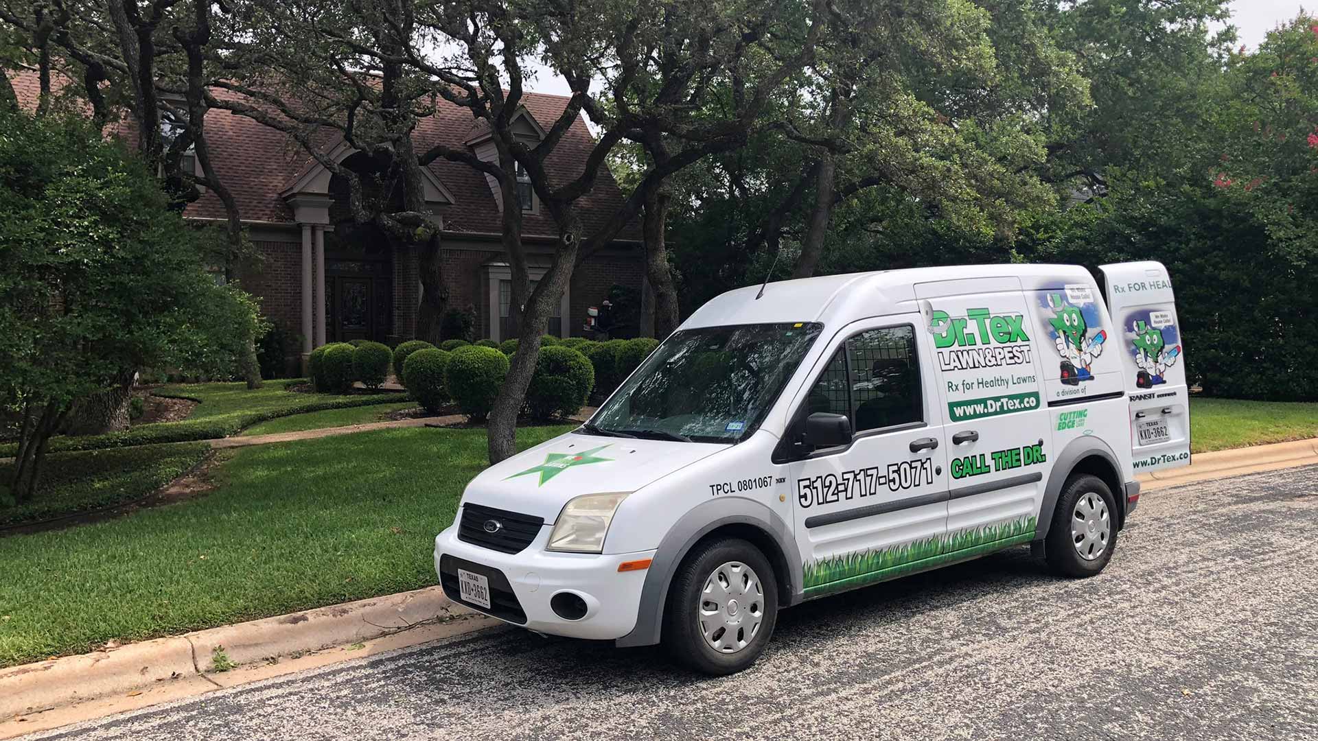 Dr. Tex Lawn & Pest service van with doors open in Austin, Texas.