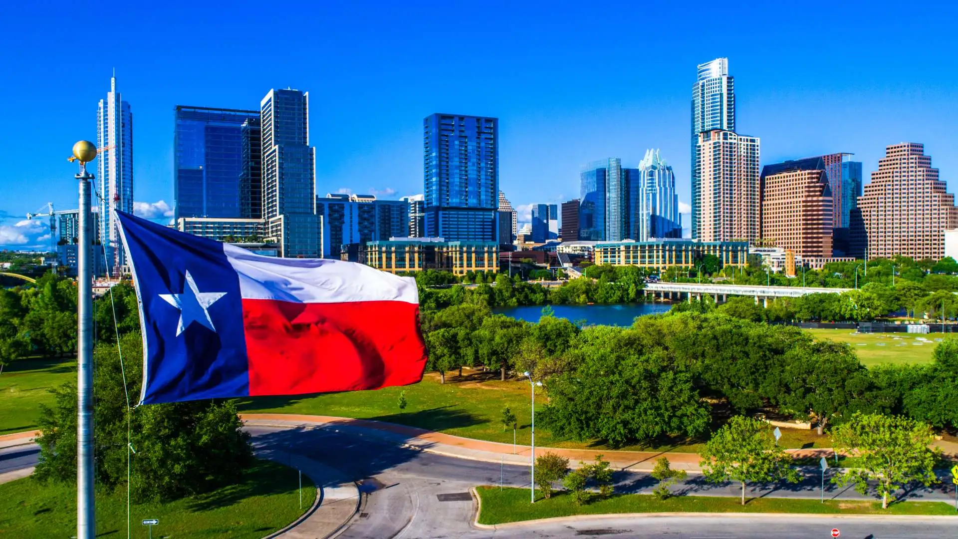 Texas flag flown in sky in Round Rock, TX.